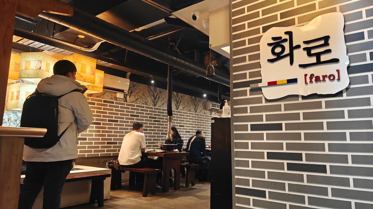 Brick dining room with timber tables