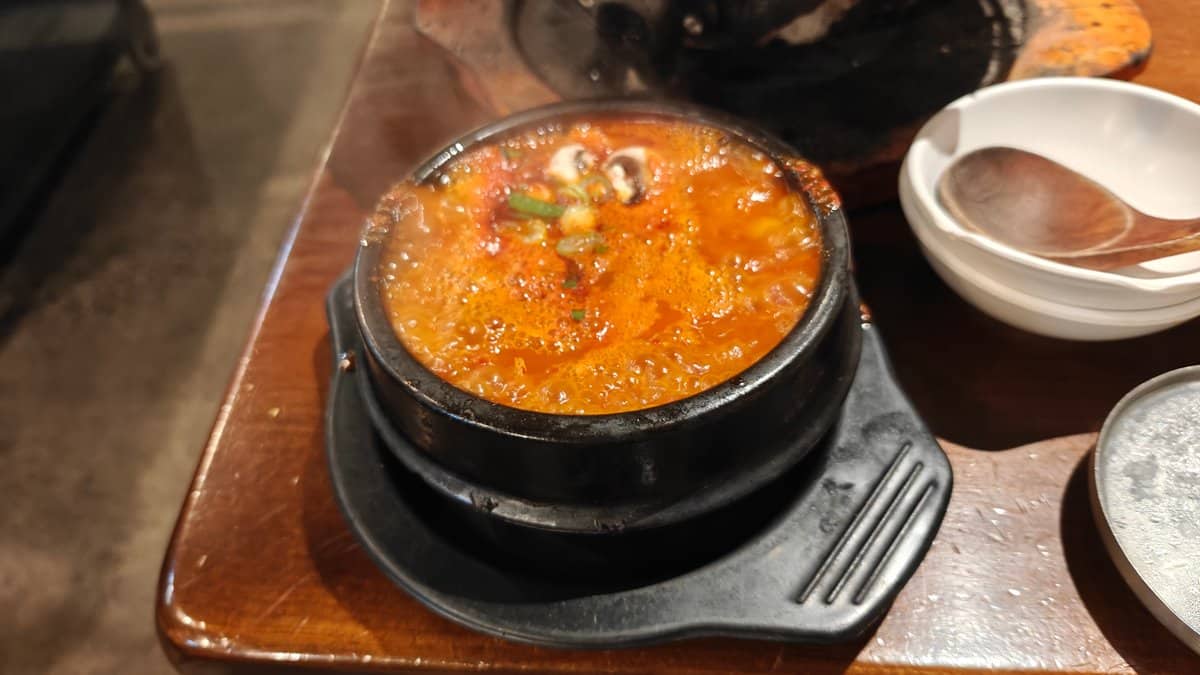 Bubbling stone pot of red stew