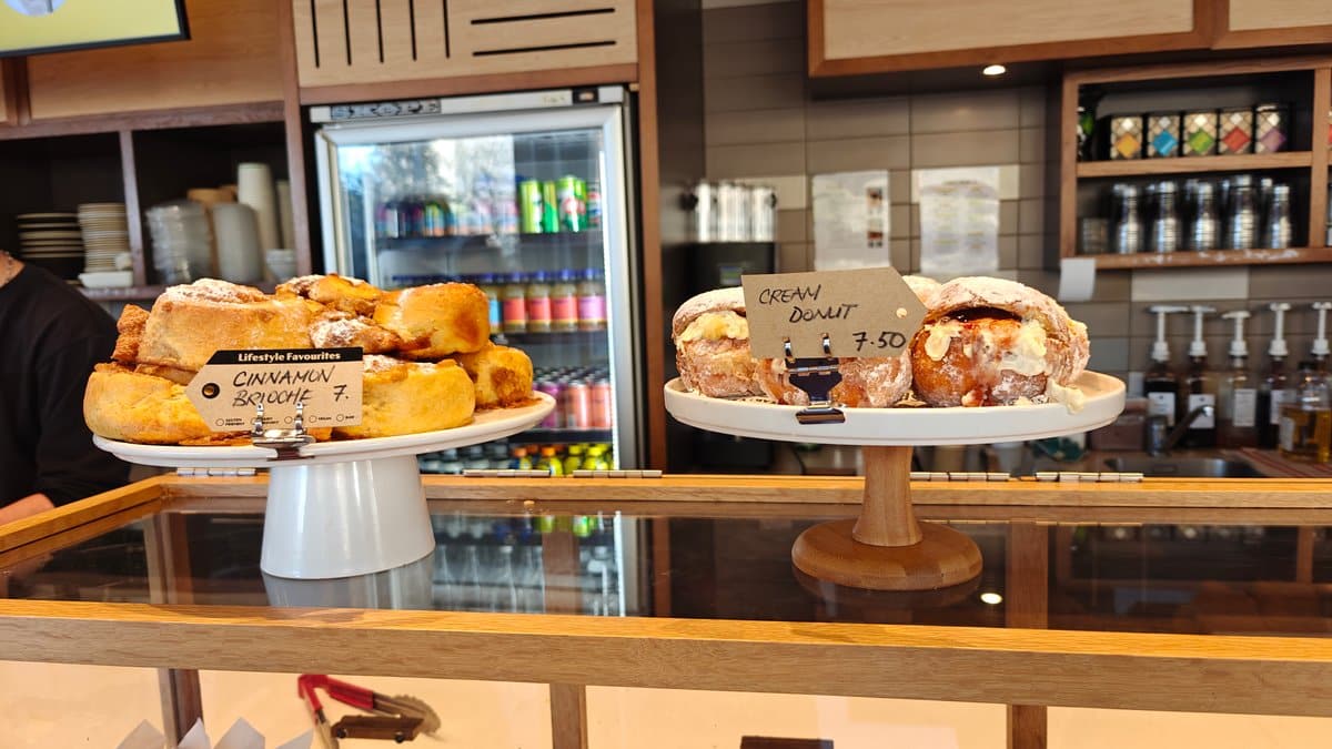 Cakes under glass on the counter