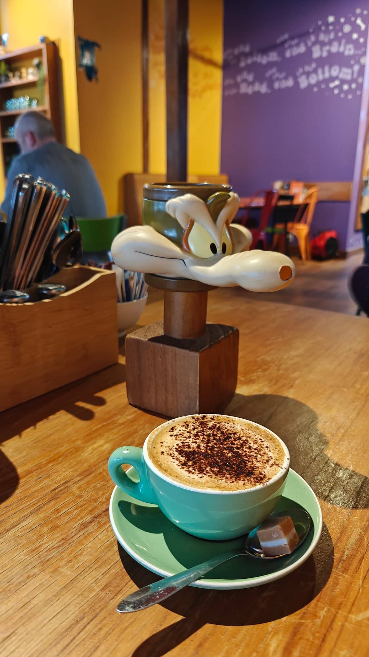 Cappuccino in a green cup
