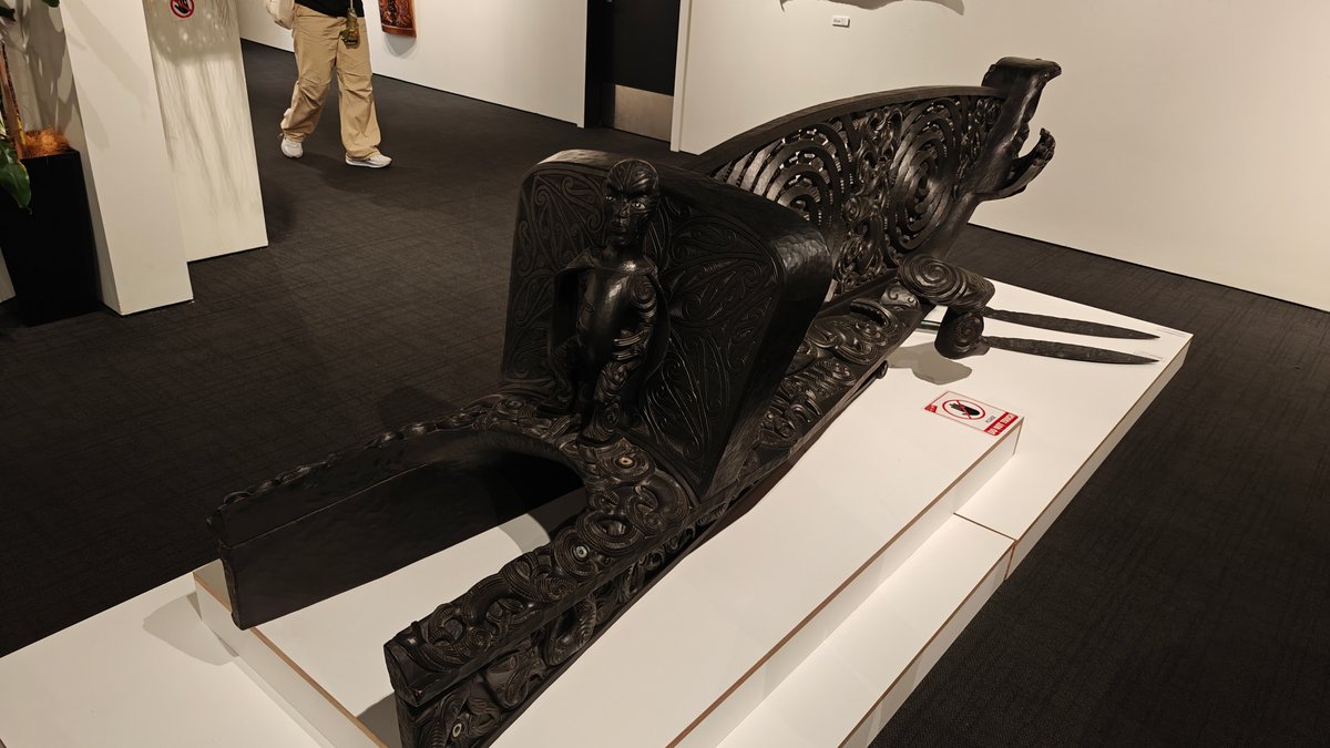 Carved canoe taurapa display