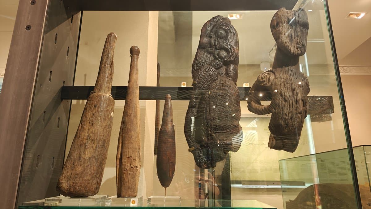 Carved wooden implements and figures