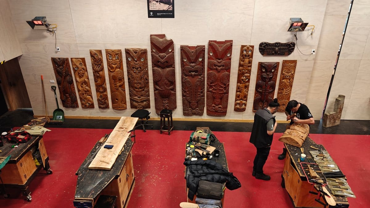 Carver finishing a timber panel