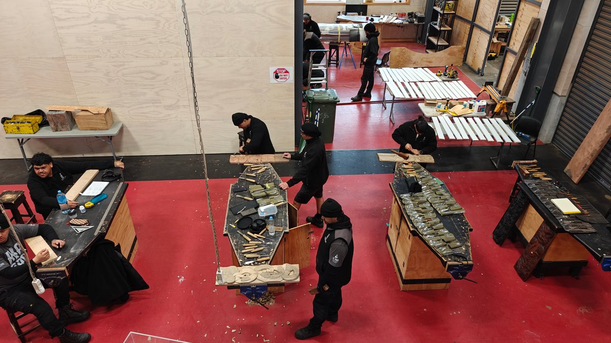 Carvers at work on a large piece in