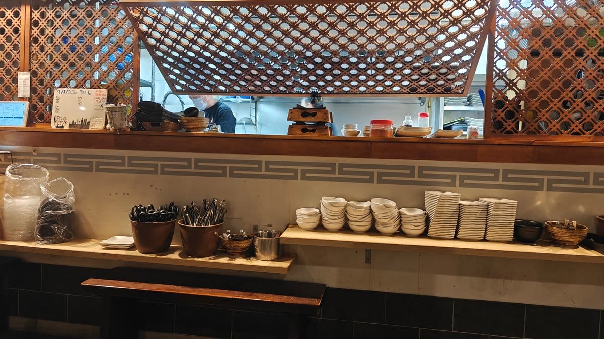 Ceramic bowls stacked beside the pass