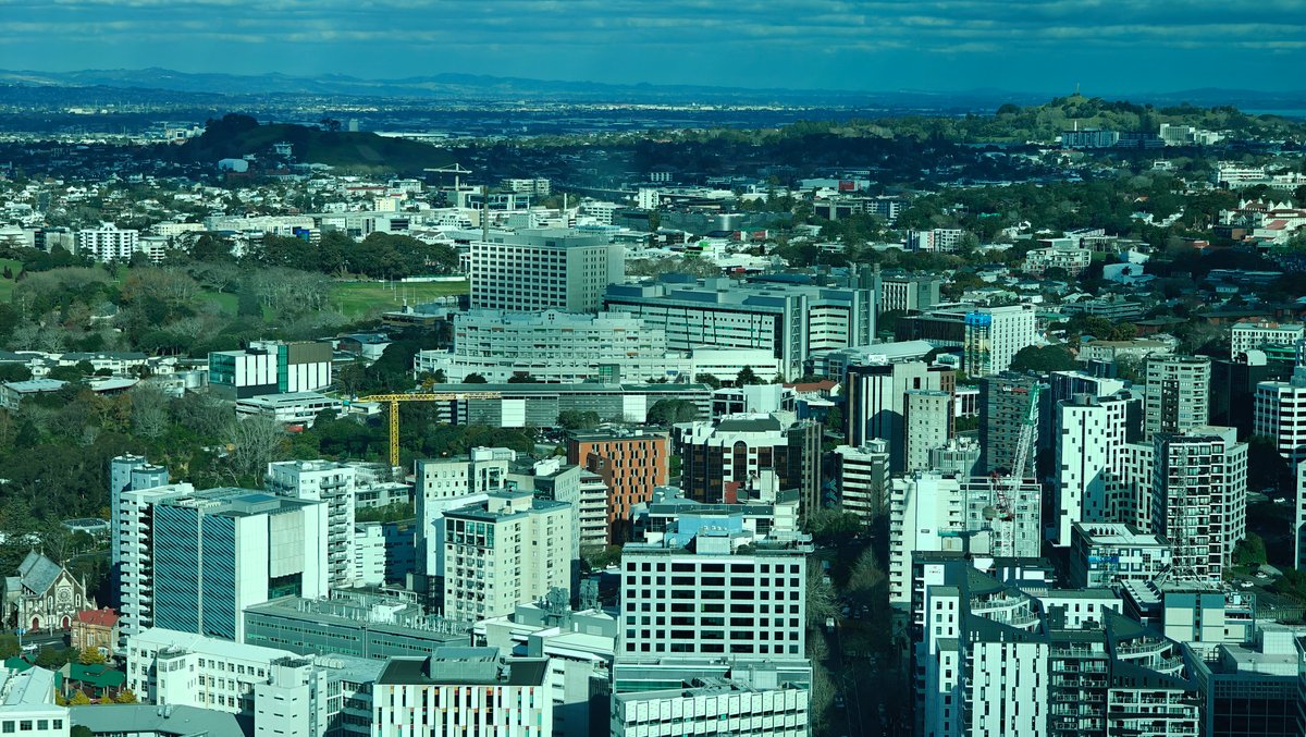 City rooftops and the suburbs running away inland.