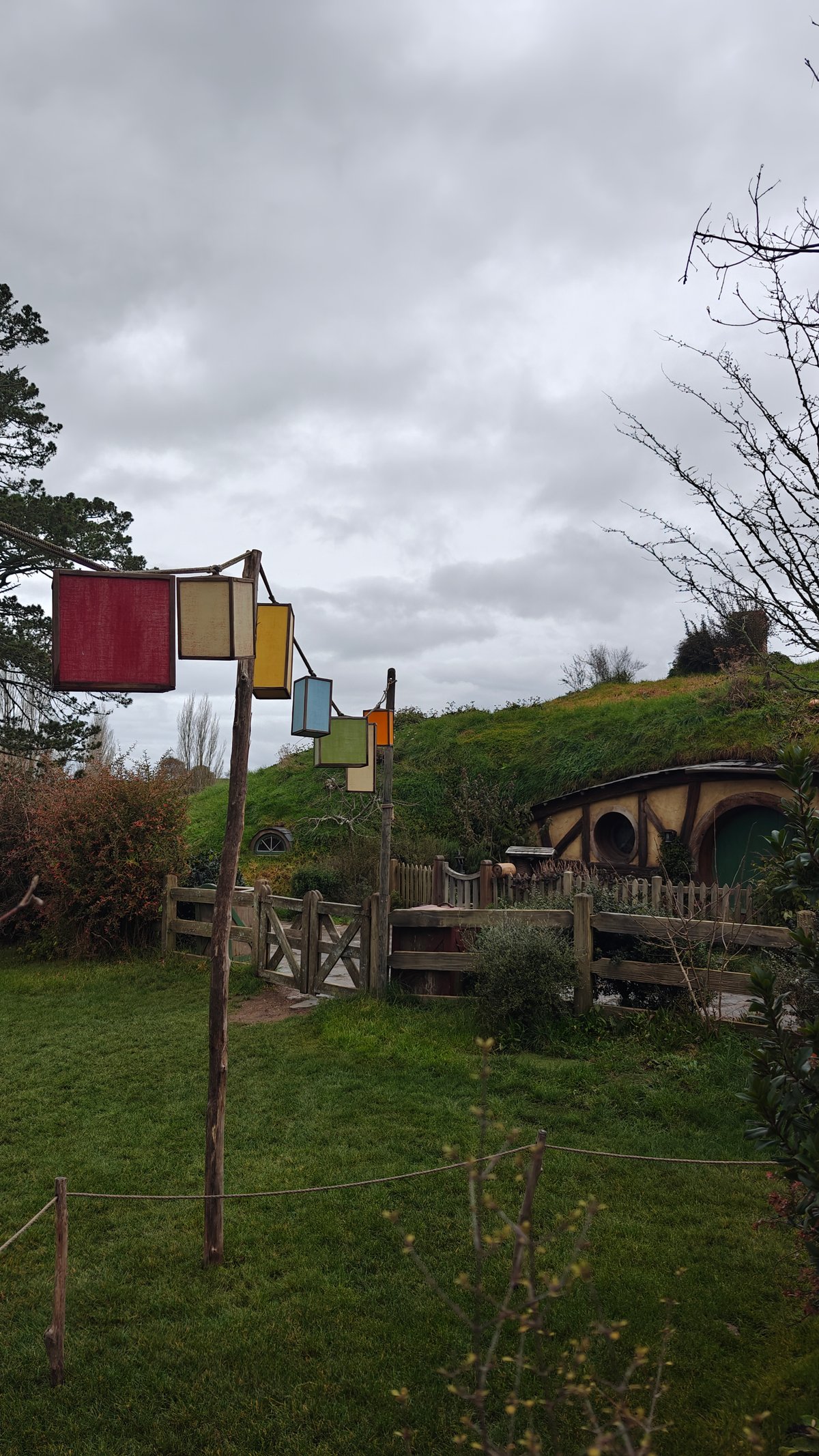 Coloured banners on a pole with a hobbit