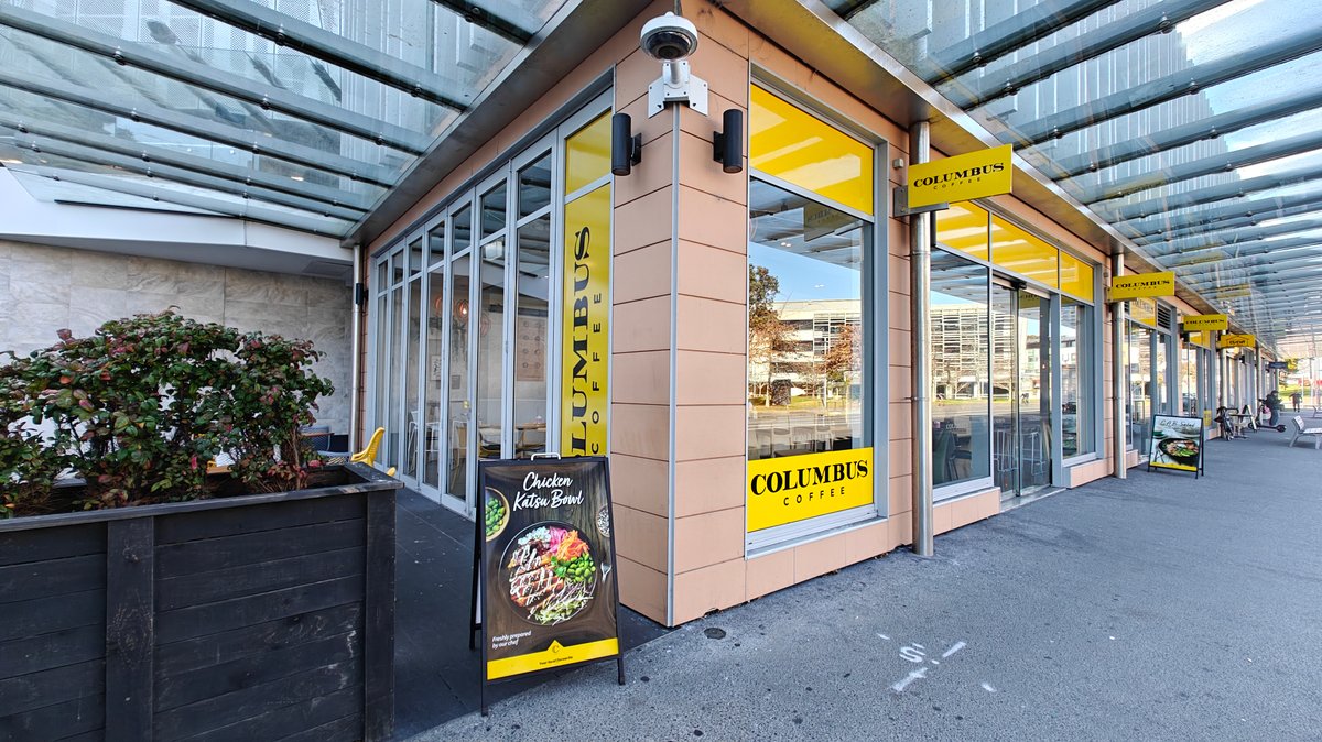 Columbus Coffee storefront along the pavement