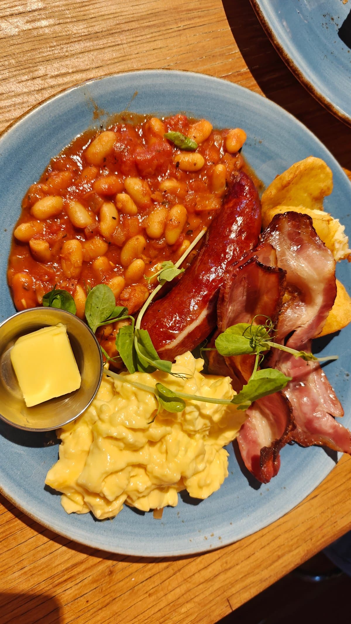 Cooked breakfast on blue plate