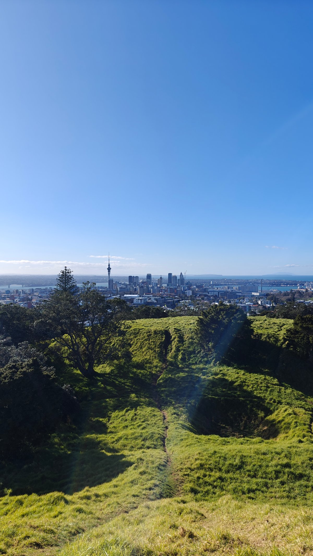 Crater foreground with city behind
