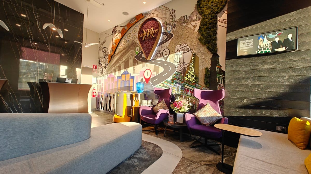 Curved reception desk and mural