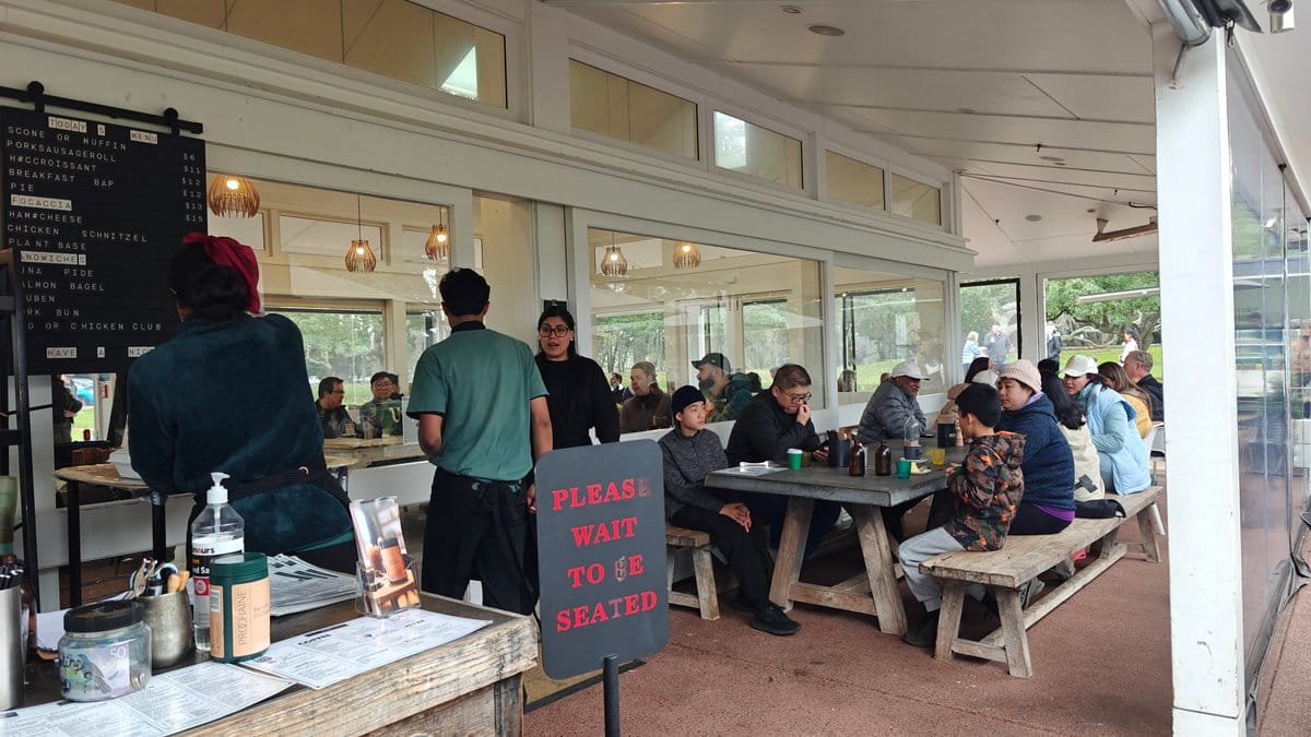 Diners at shared outdoor tables