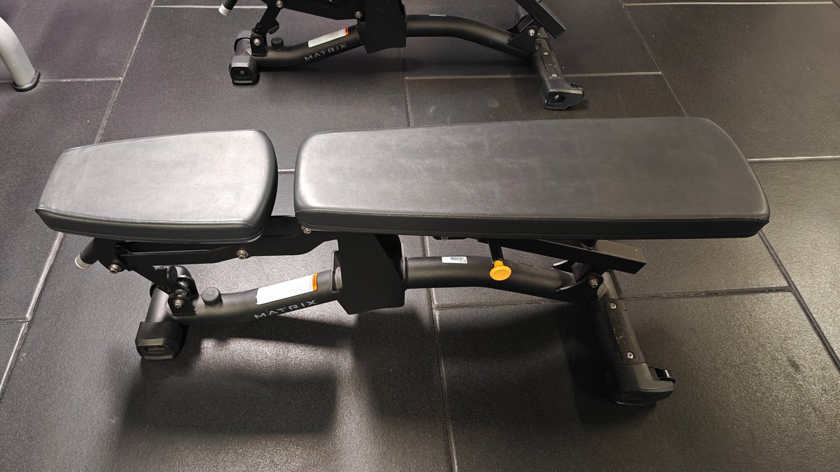 Flat bench on rubber gym matting