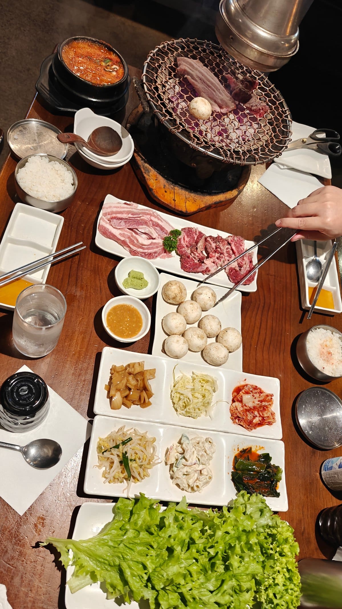 Full grill table with meat and sides