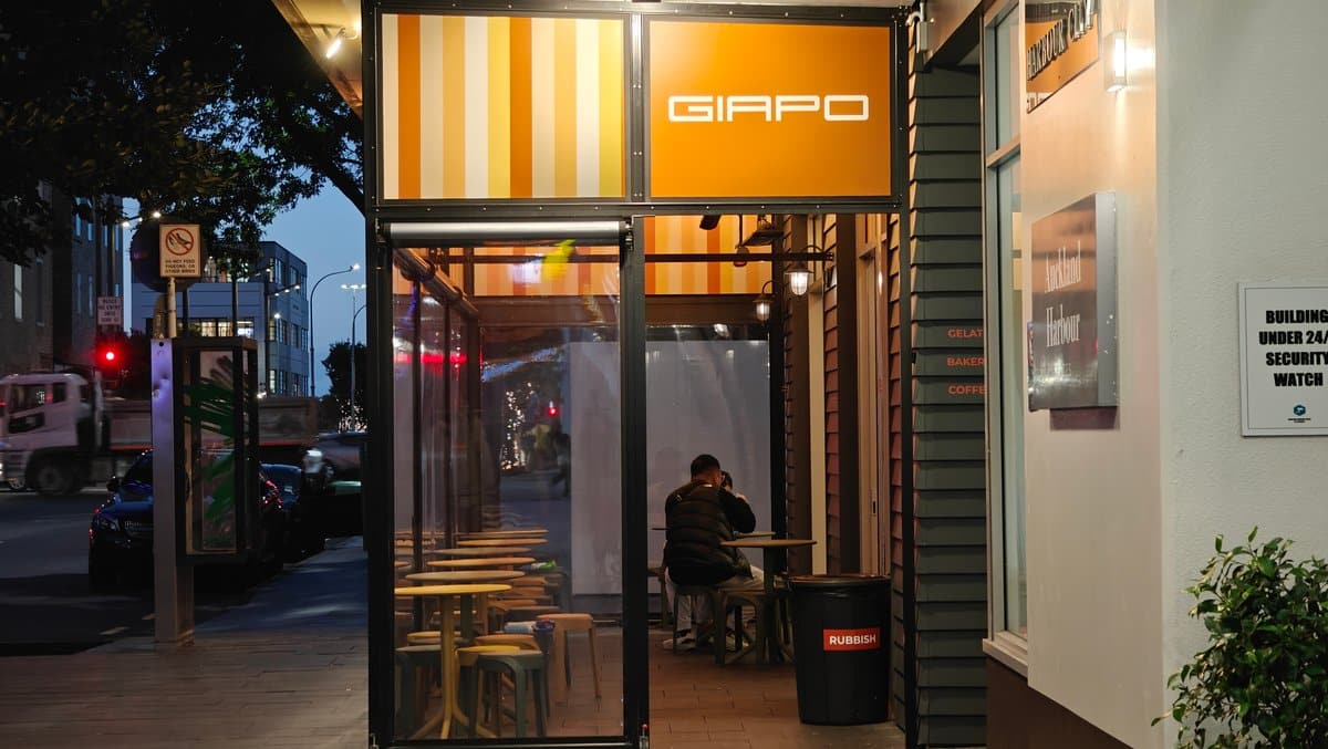 Giapo shopfront glowing at dusk