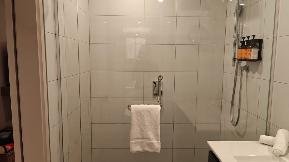 Glass shower with hanging towels