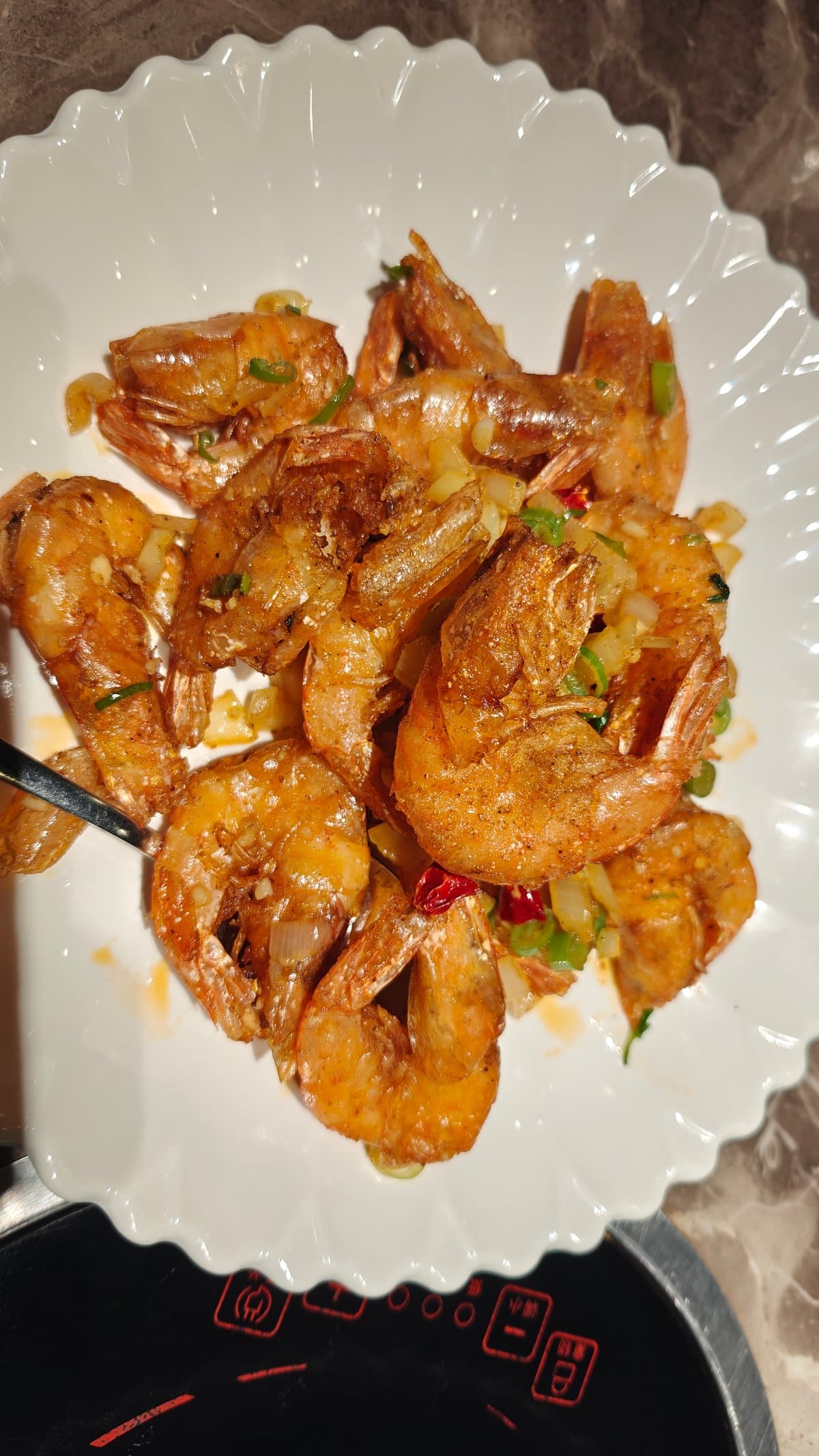 Glossy golden shell-on prawns