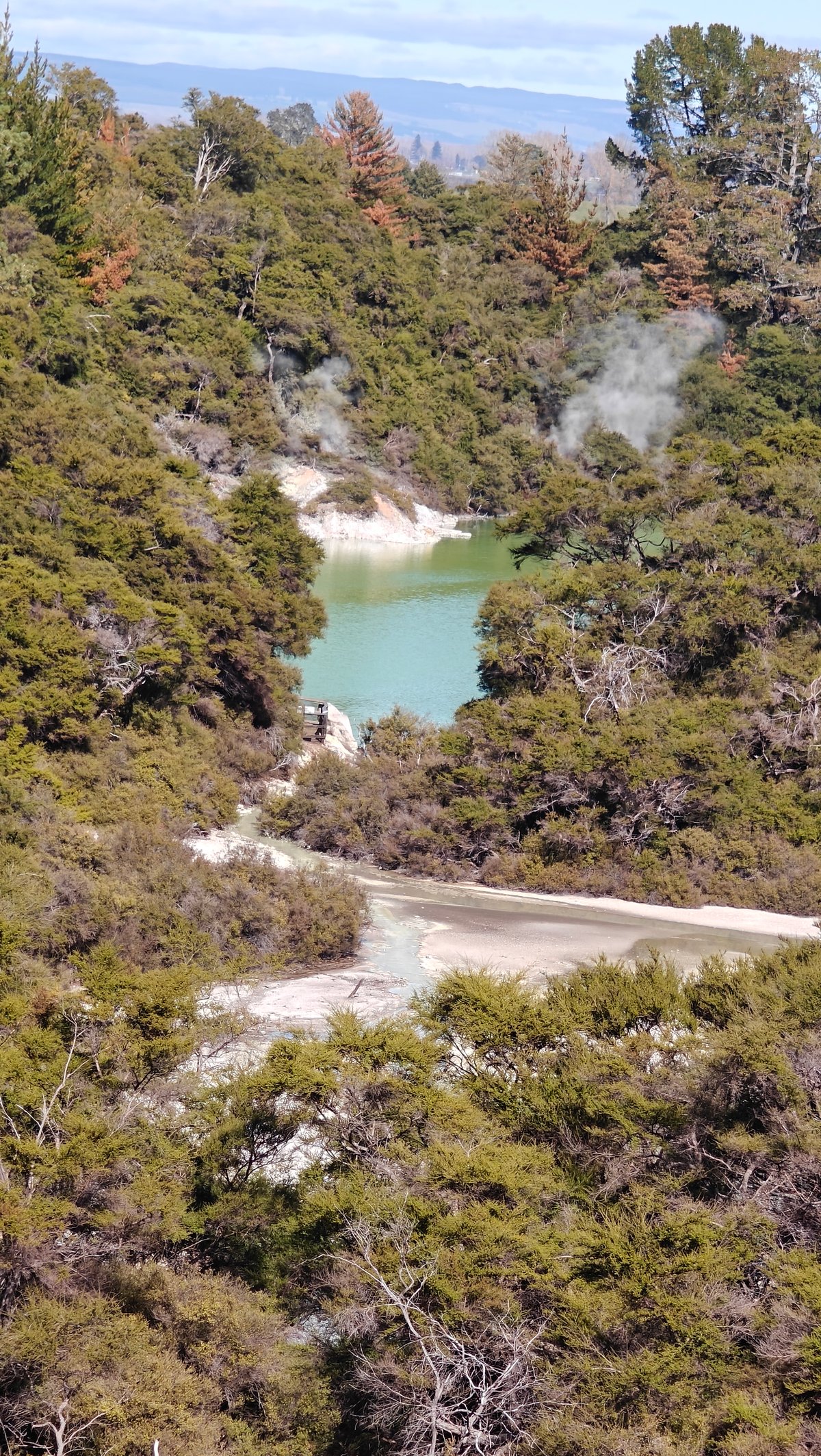 Green crater lake below