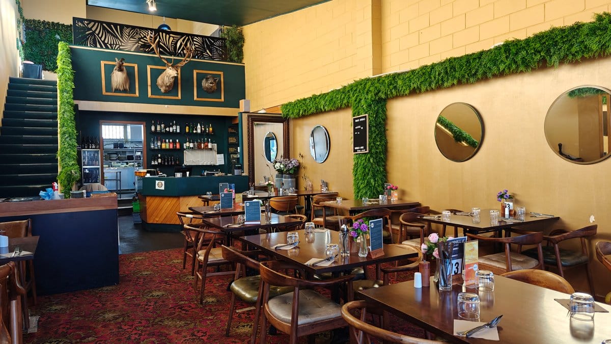 Green panelled dining room interior