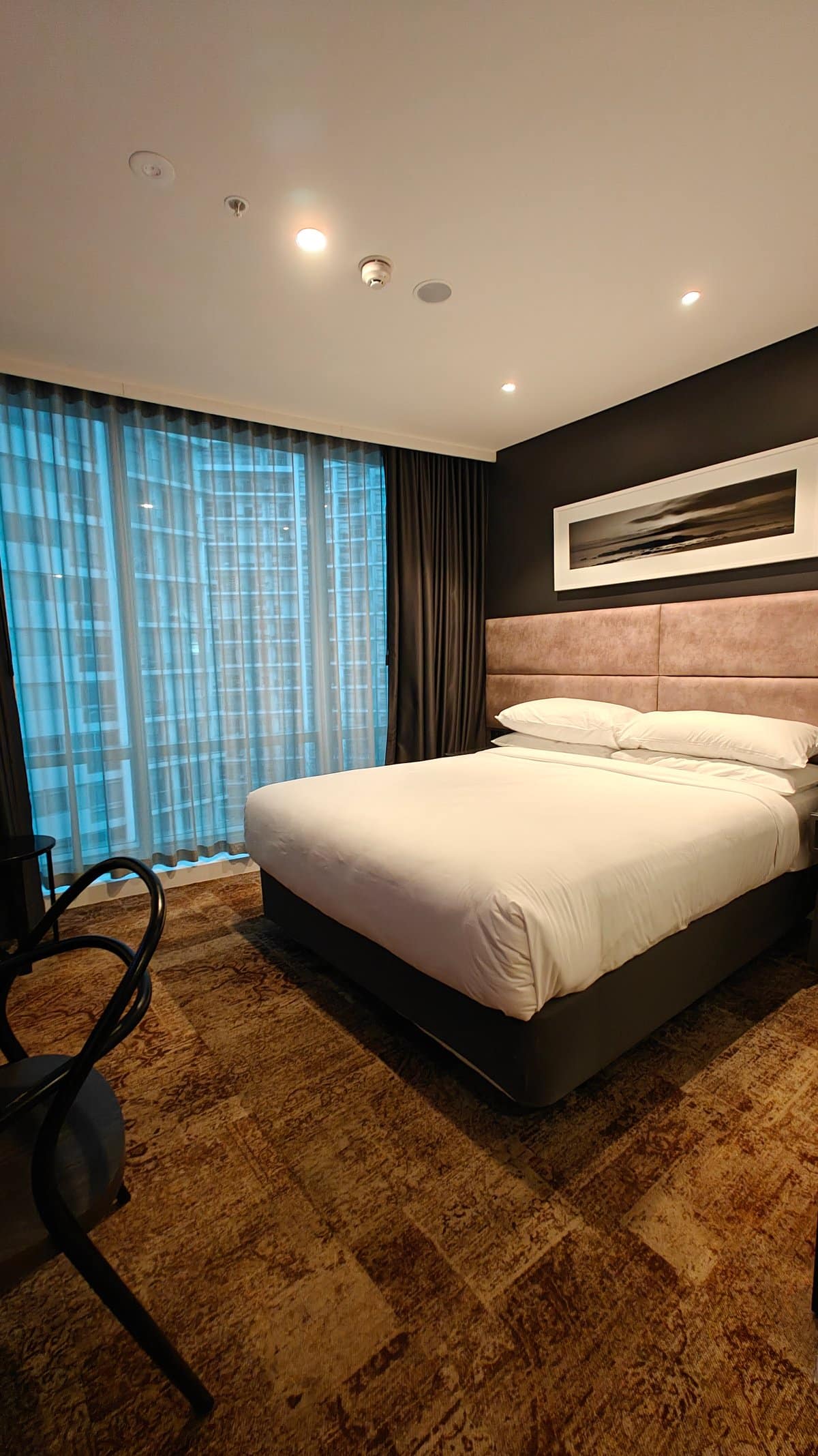 Guest room with made bed