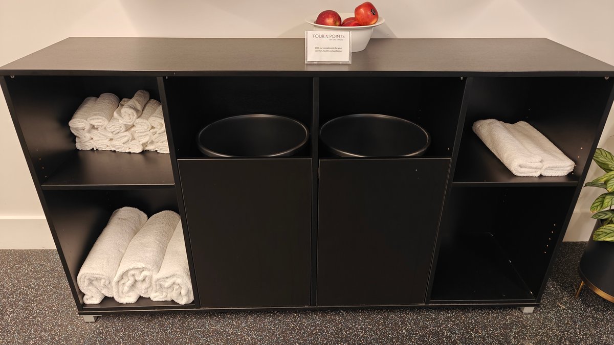 Gym towel station with folded towels