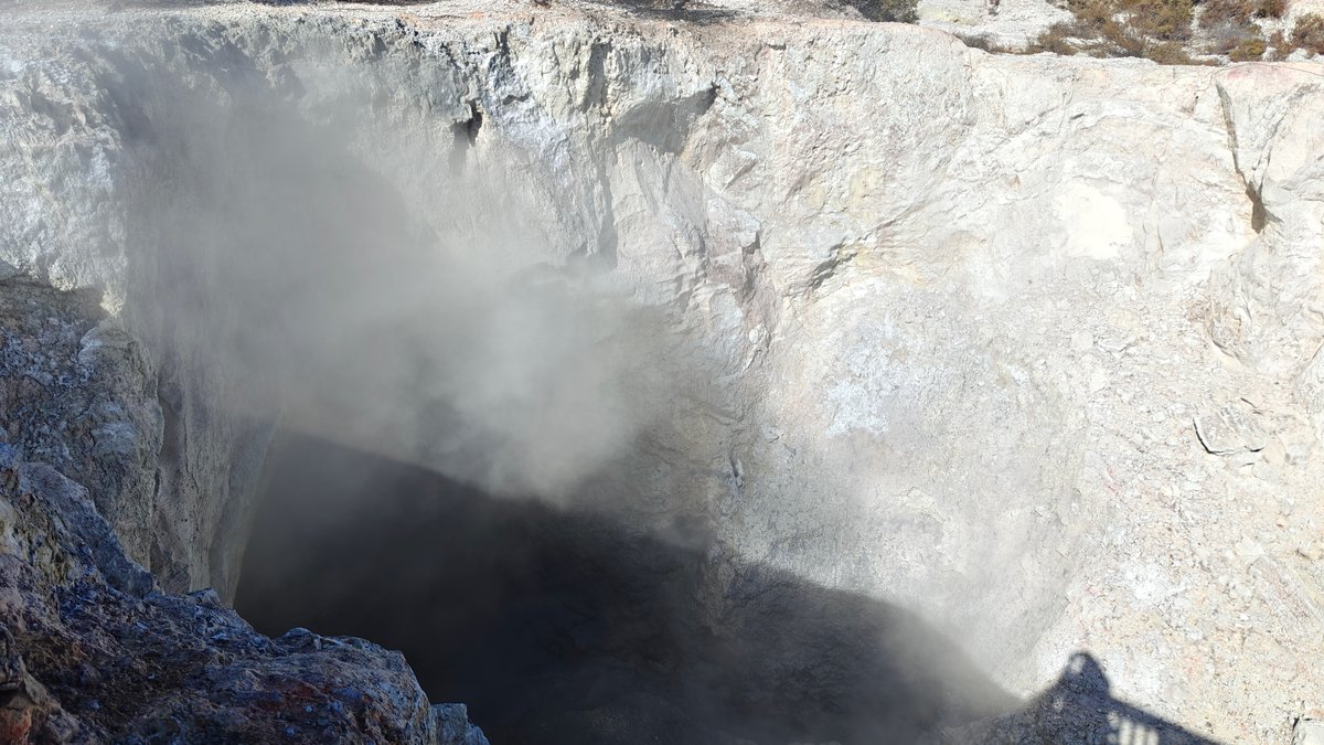 Heavy steam pouring from crater