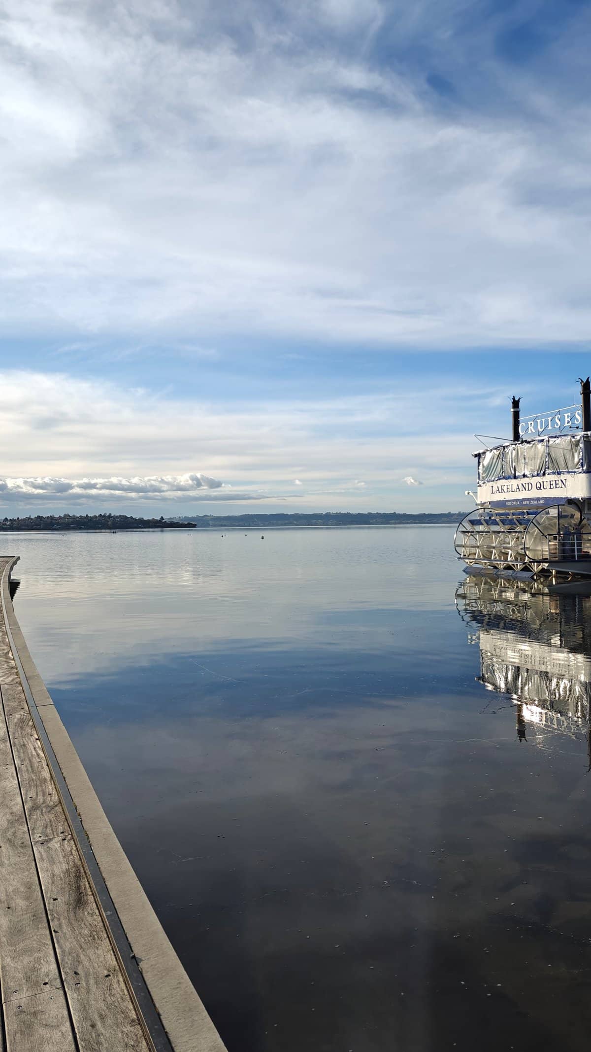 Jetty and steamer reflected calmly