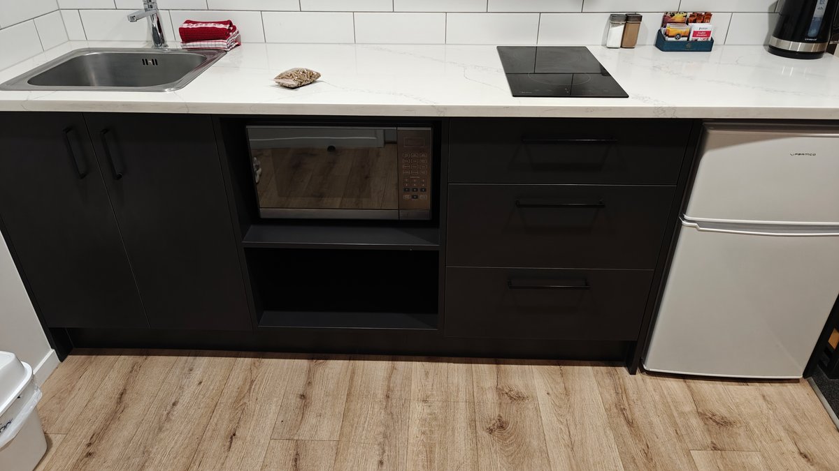 Kitchenette with sink hob and fridge