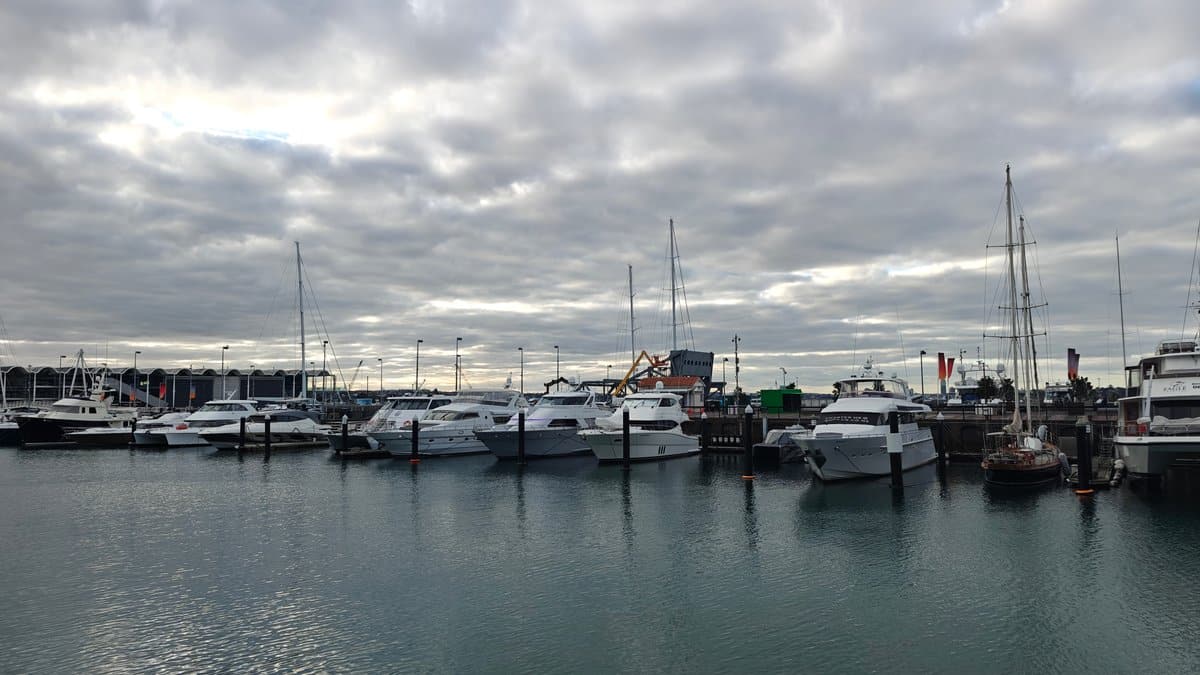 Launches moored under grey cloud