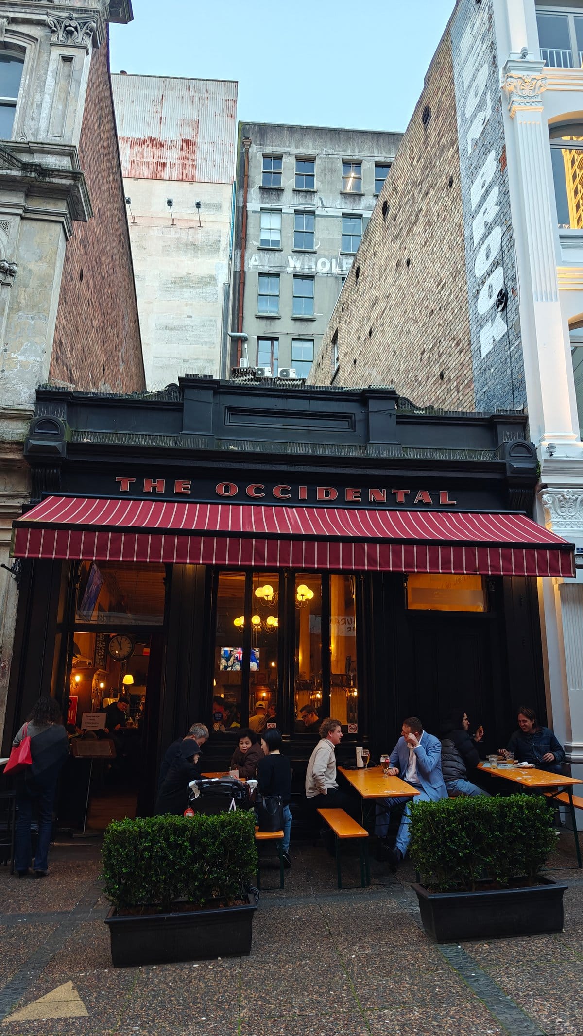 Lit Occidental frontage at dusk