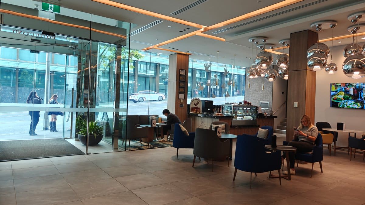Lobby seating behind tall glazing