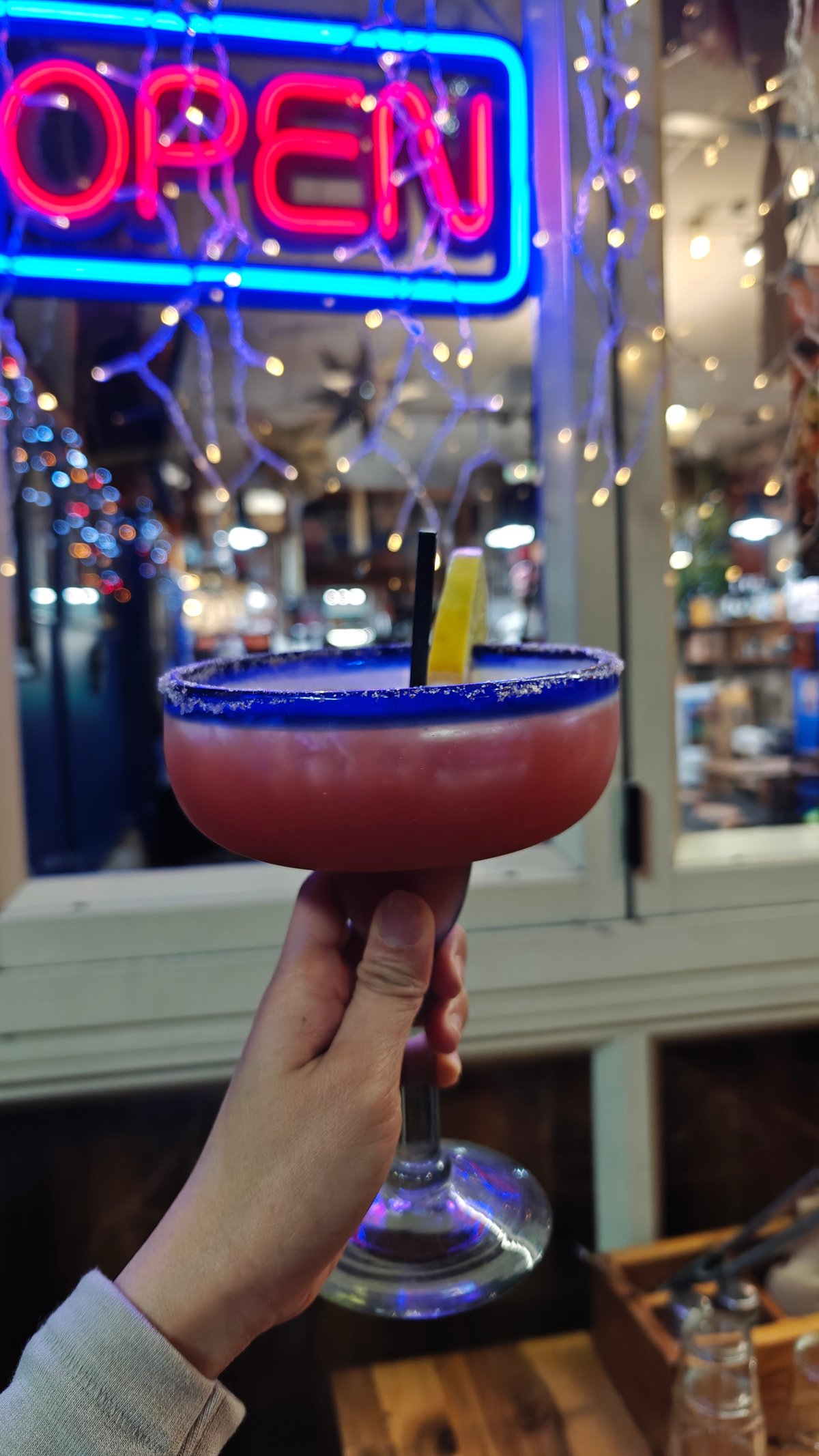 Margarita held by OPEN neon