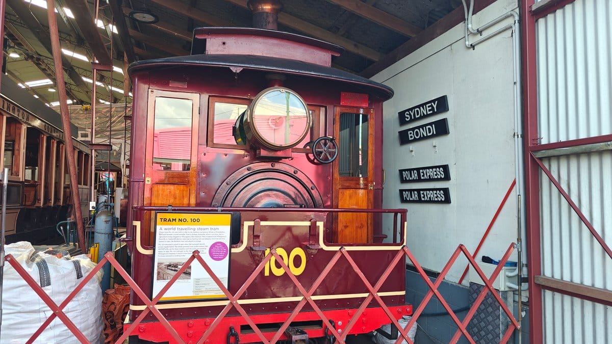 Maroon steam tram number 100