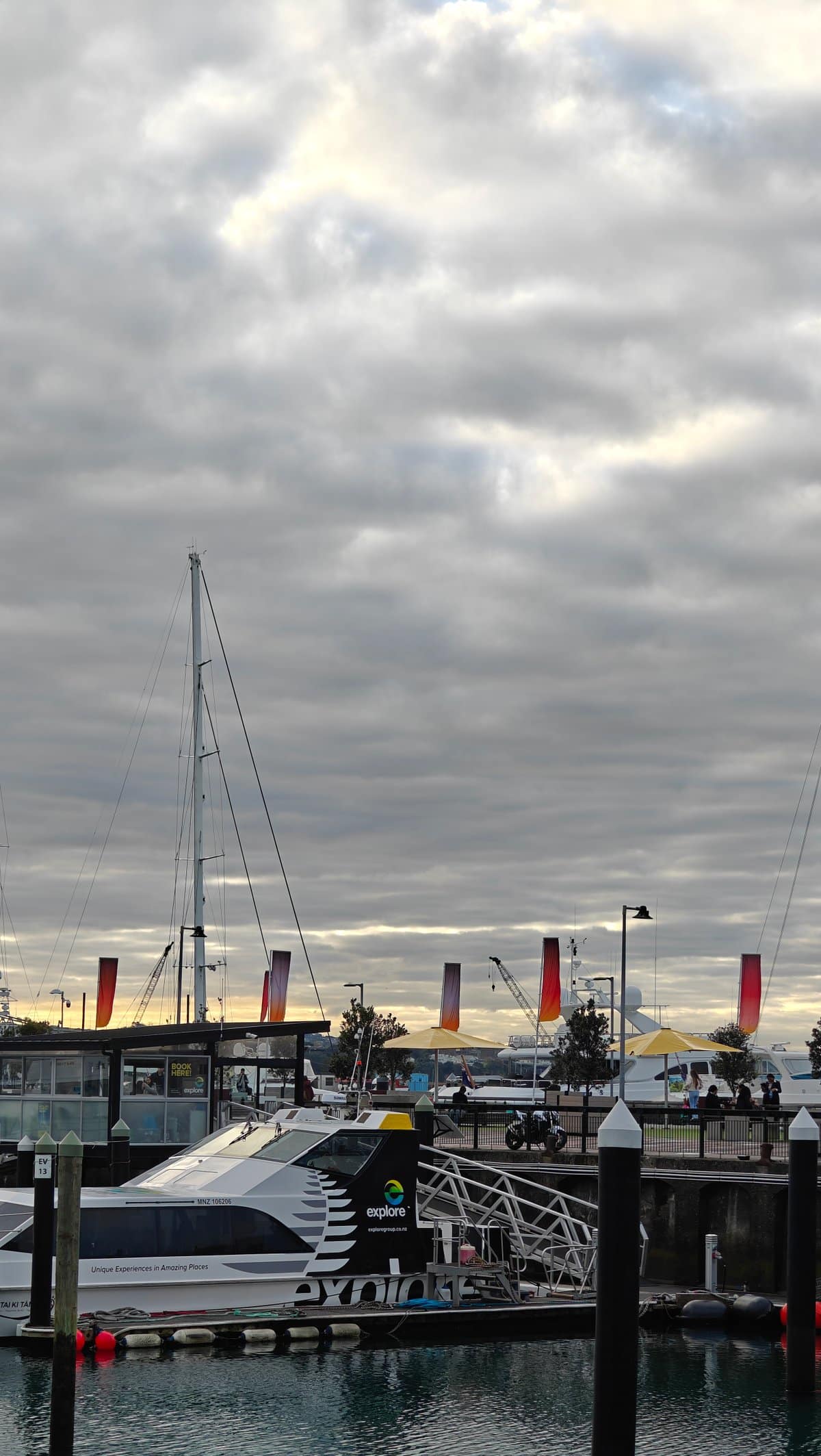 Masts and a pontoon under the cloud.