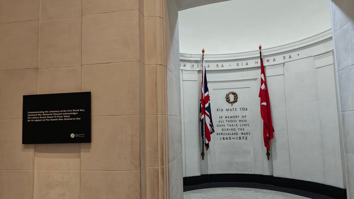 Memorial hall with flags and wreath