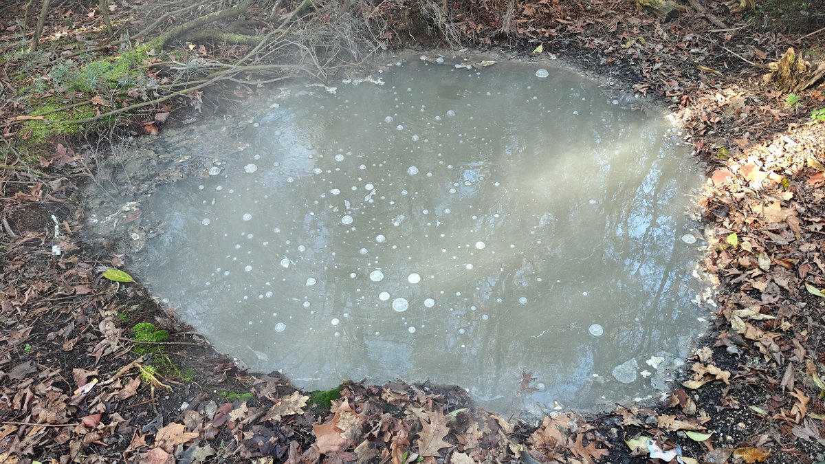 Milky grey pool in rock basin