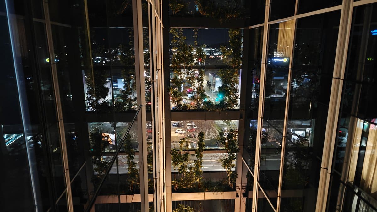 Night atrium through layered glass