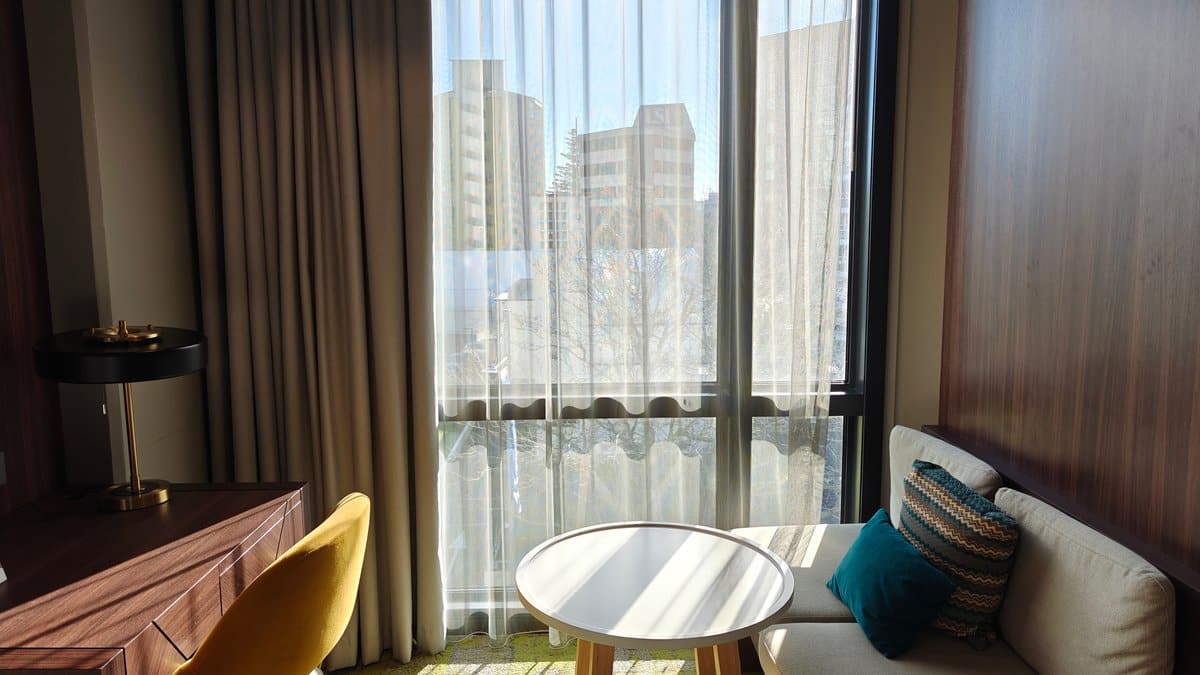 Open curtains over window seating