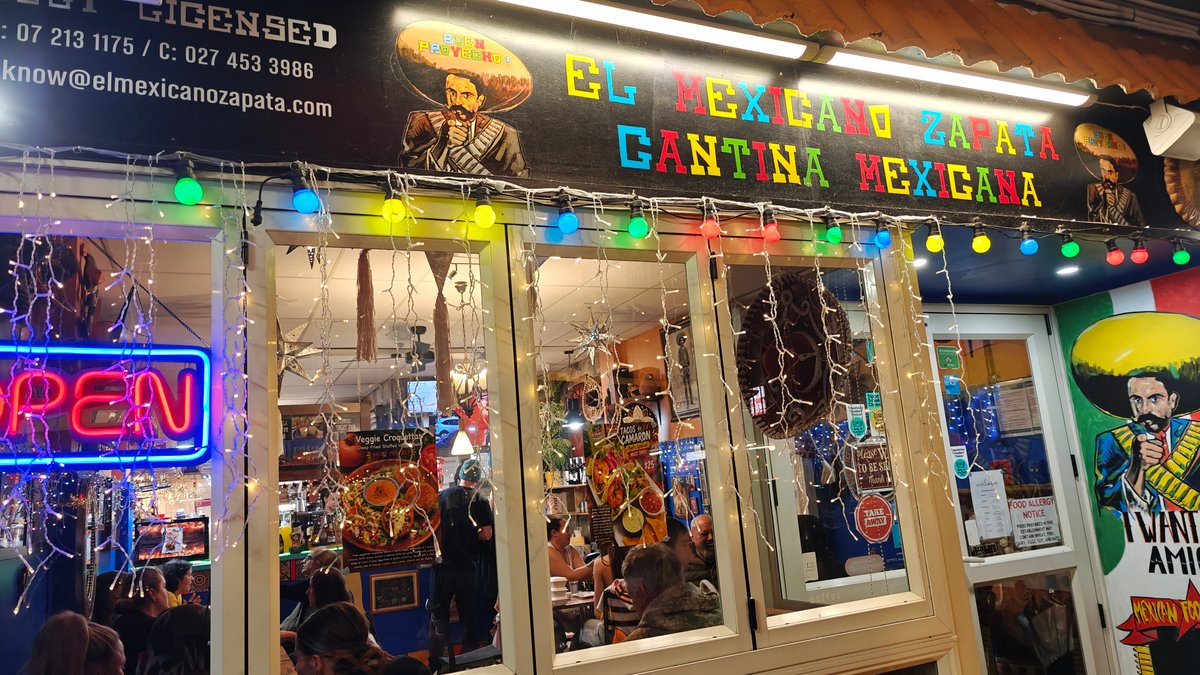 OPEN neon glowing at entrance