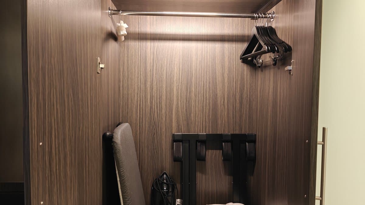 Open wardrobe with luggage bench