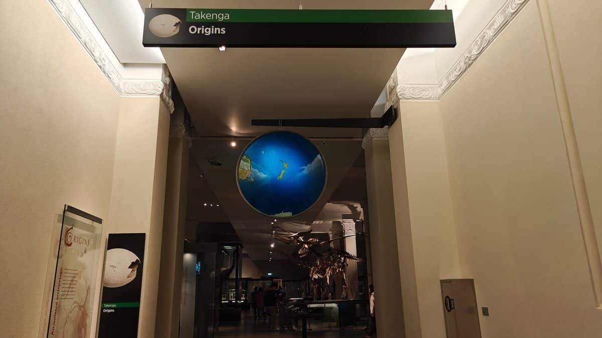 Origins gallery with a glowing globe