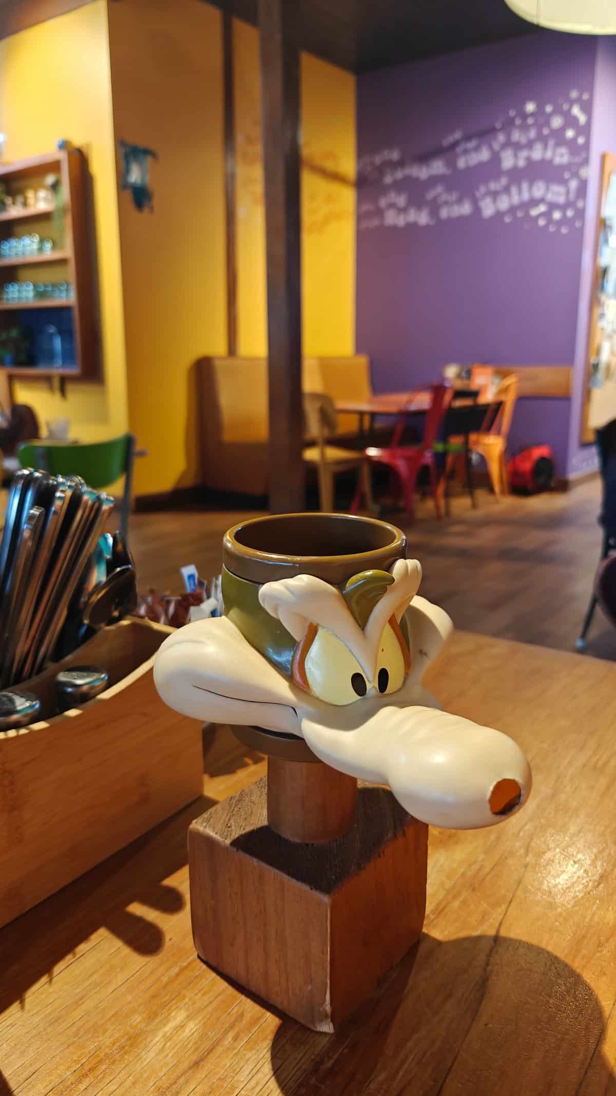 Painted dog figurine on table