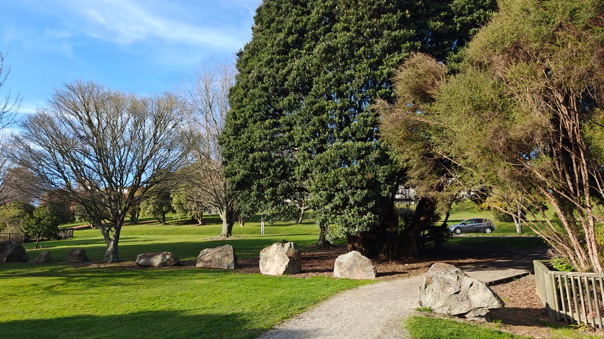 Parkland with a path and boulders set along