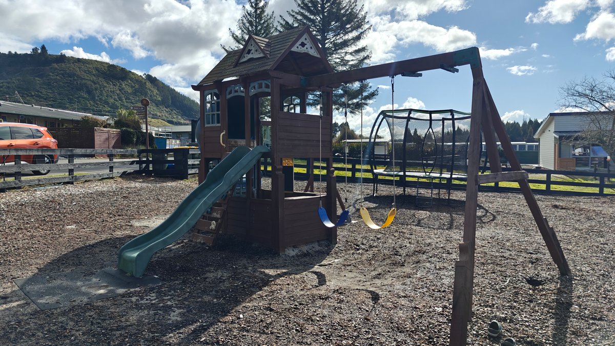 Play tower with slide and swings