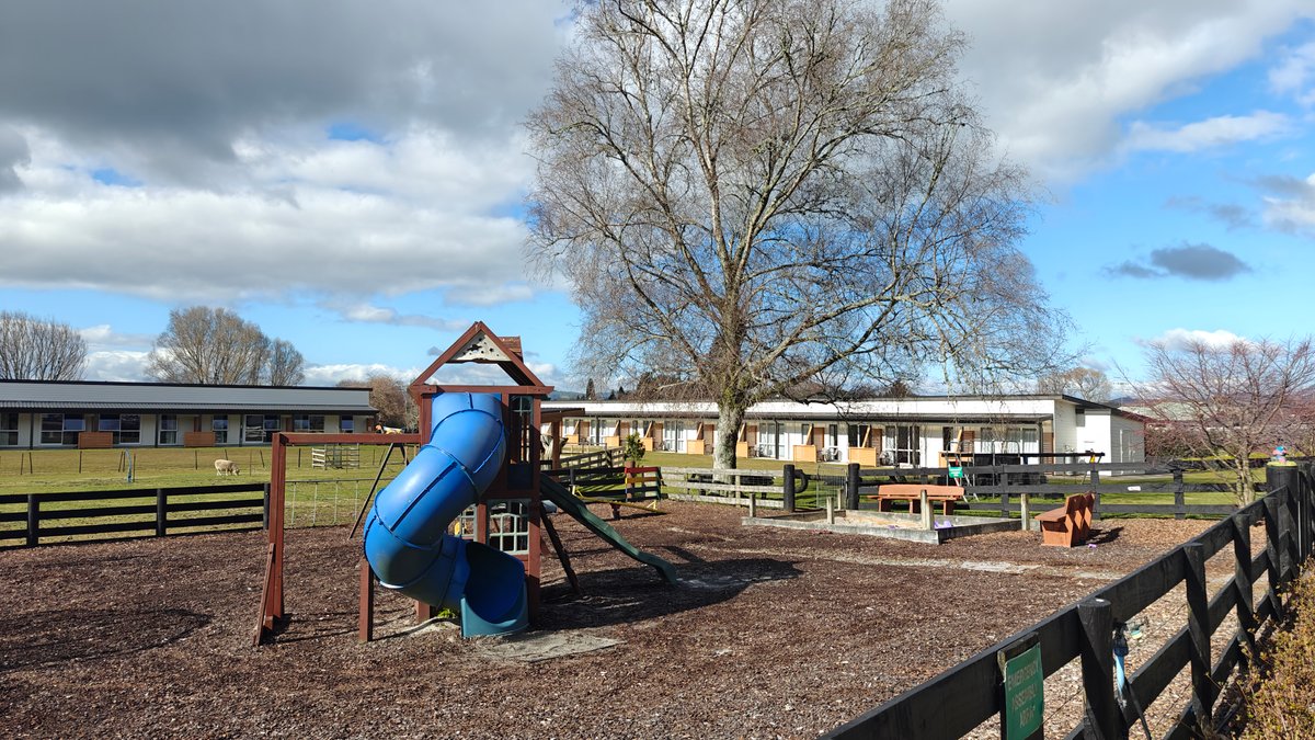 Playground slide beside motel units
