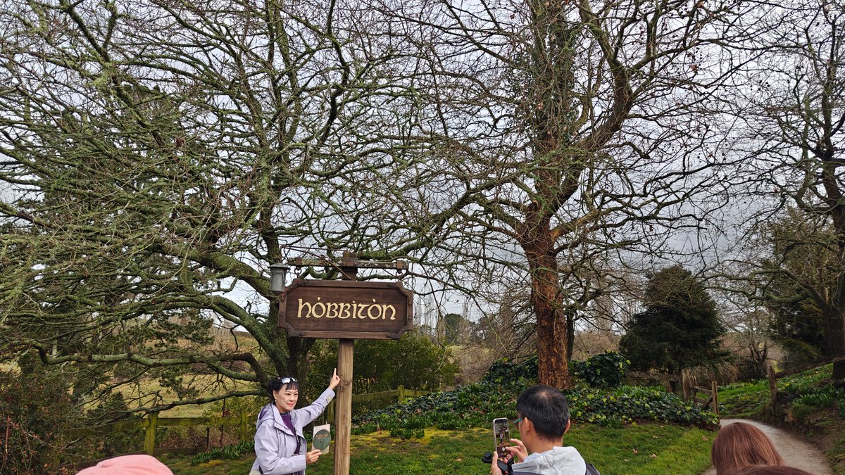 Posing by the Hobbiton signpost