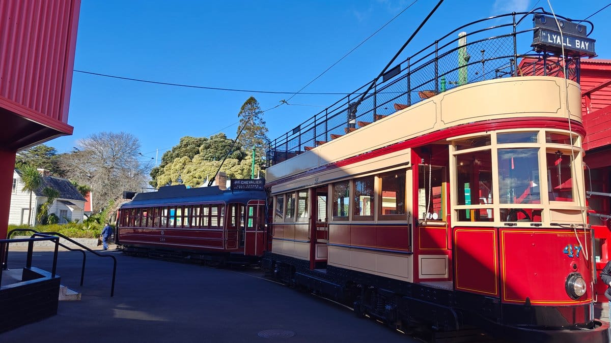 Red double-deck tram on tramway