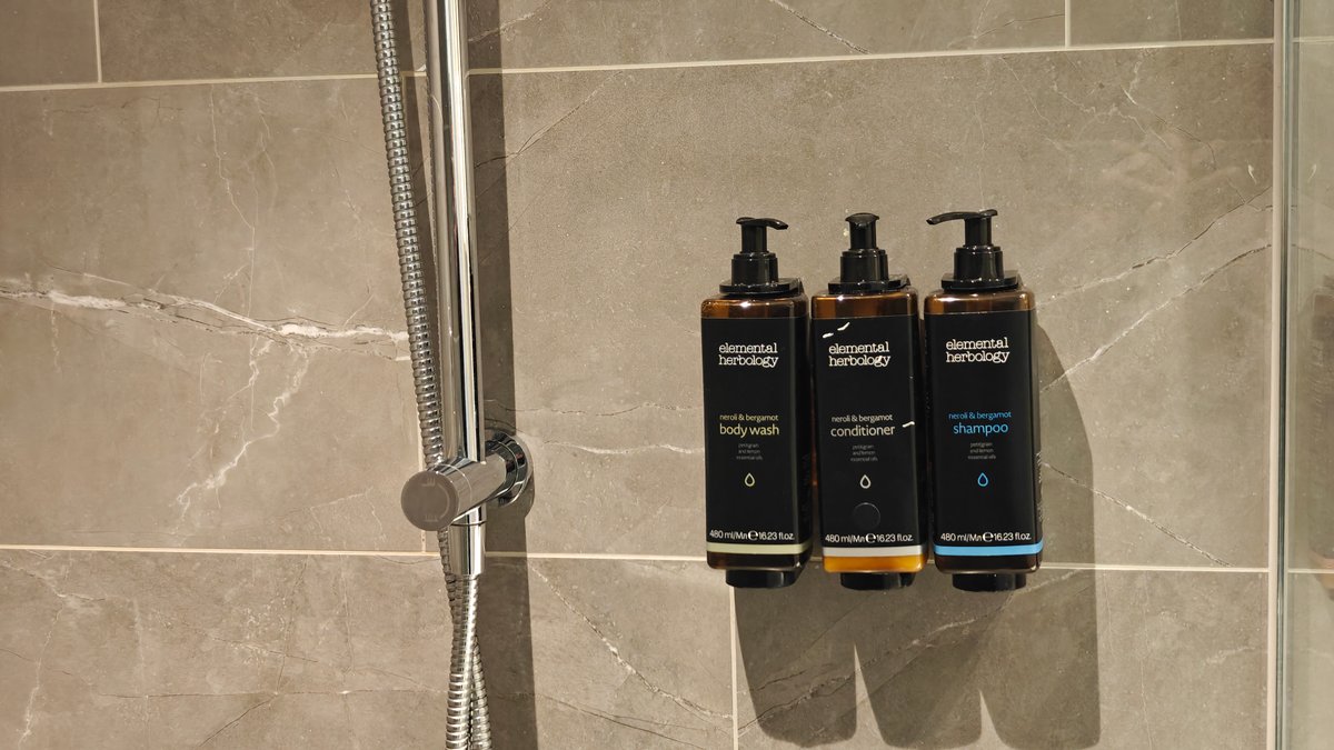 Shower handset and wall dispensers