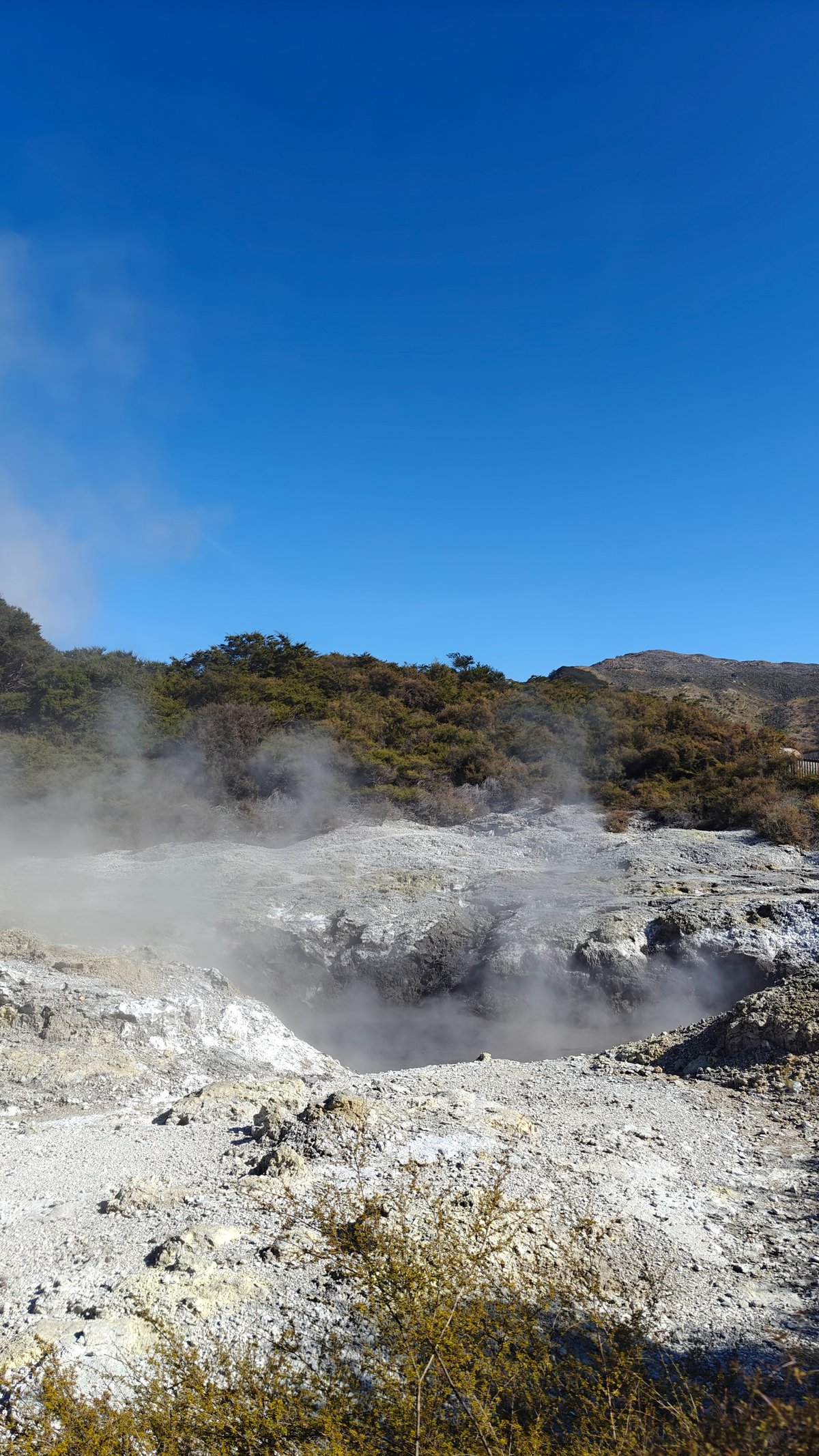 Steam against a deep blue sky