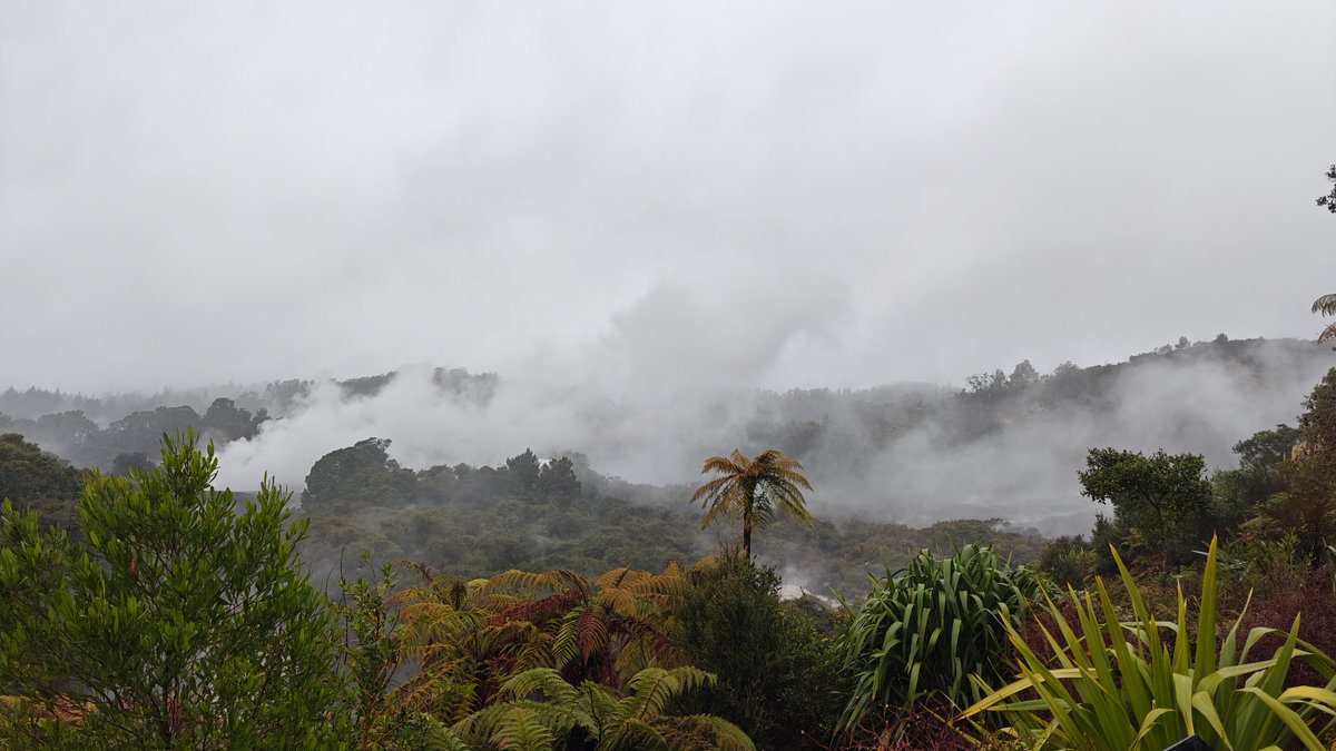 Steam rising through geothermal valley